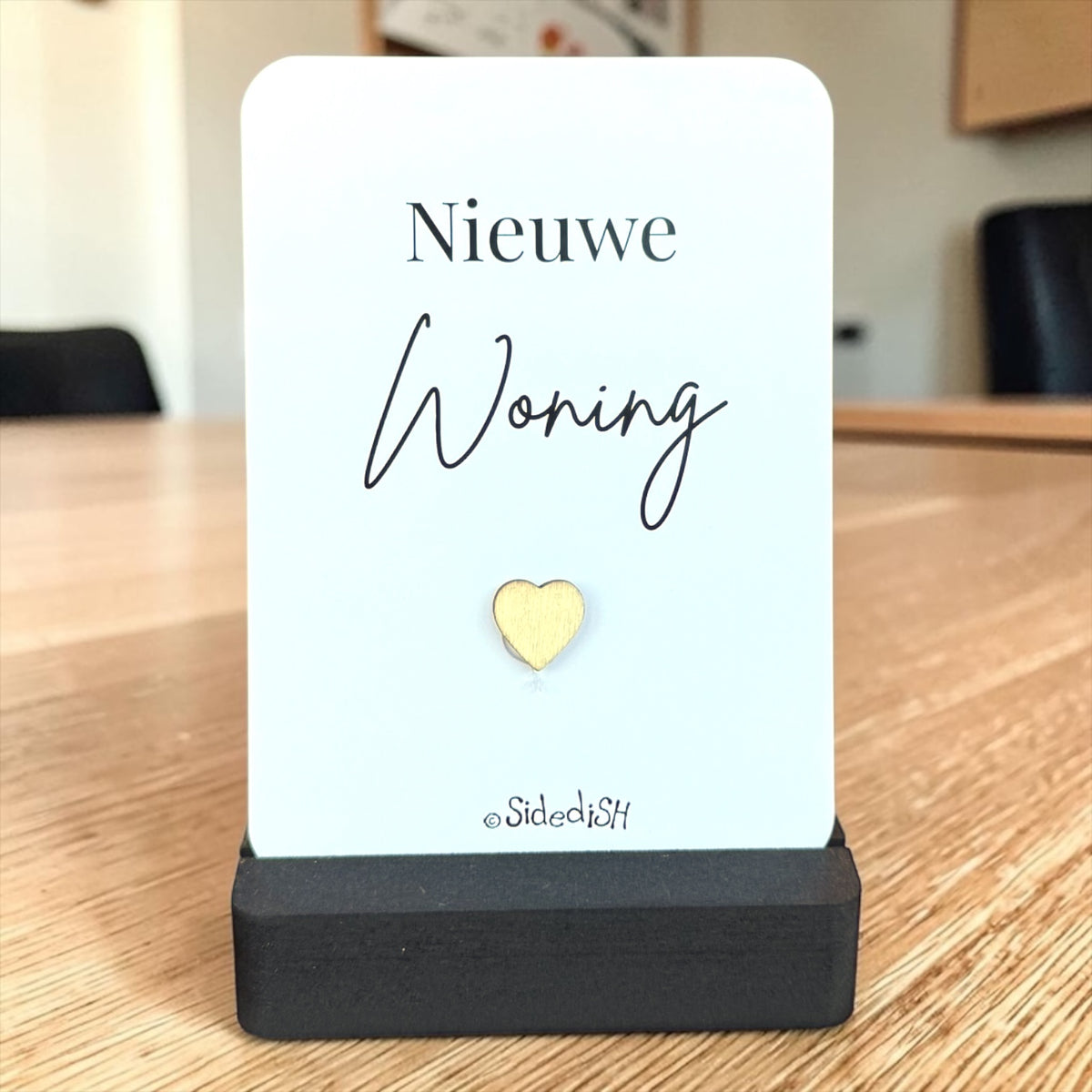 Kaartje op houder nieuwe woning