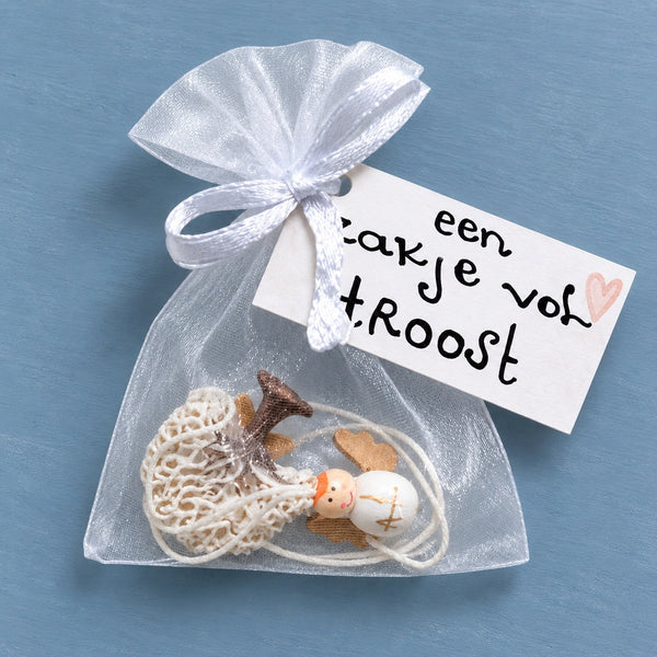 Zakje vol troost plat op blauwe achtergrond